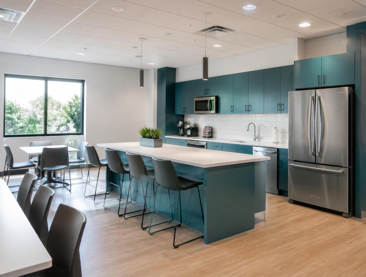 Immaculate office breakroom with spotless stainless appliances